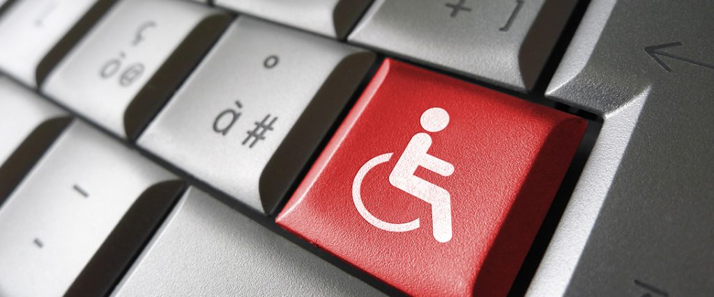 Web content accessibility concept with wheelchair icon and symbol on a red computer key for blog and online business.